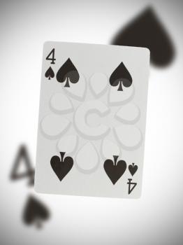 Playing card with a blurry background, four of spades