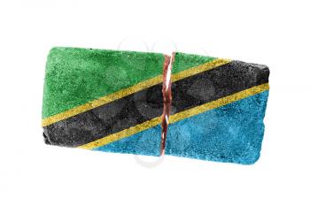Rough broken brick, isolated on white background, flag of Tanzania