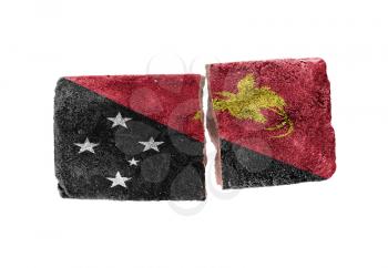 Rough broken brick, isolated on white background, flag of Papua New Guinea