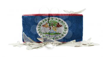 Brick with broken glass, violence concept, flag of Belize