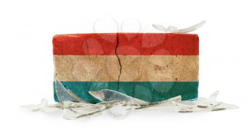Brick with broken glass, violence concept, flag of Luxembourg
