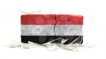 Brick with broken glass, violence concept, flag of Yemen