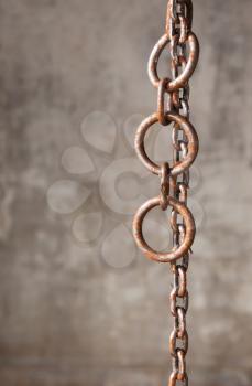Old weathered industrial chain with rings, industrial setting