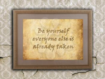 Old wooden frame with written text on an old wall - Be yourself