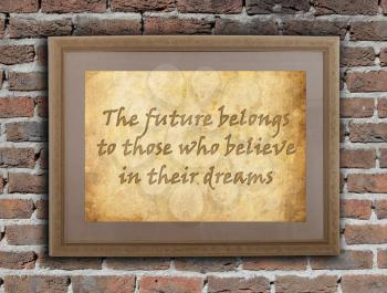 Old wooden frame with written text on an old wall - The future belong to those who believe in their dreams
