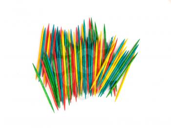 Many colorful toothpicks on a white background