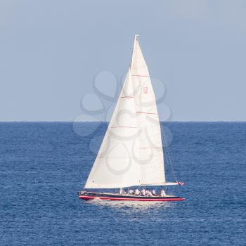 Small sailboat sailing on the Caribbean sea