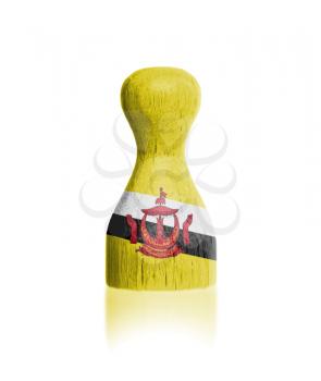 Wooden pawn with a painting of a flag, Brunei