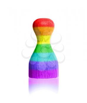 Wooden pawn with a painting of a flag, rainbow flag