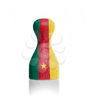 Wooden pawn with a painting of a flag, Cameroon