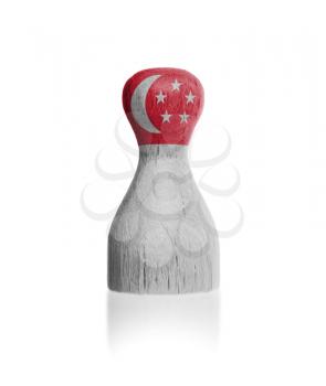 Wooden pawn with a painting of a flag, Singapore