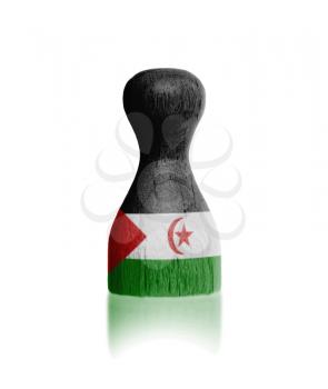 Wooden pawn with a painting of a flag, Western Sahara