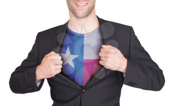 Businessman opening suit to reveal shirt with state flag (USA), Texas