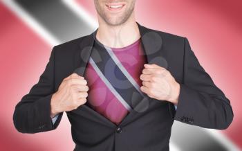 Businessman opening suit to reveal shirt with flag, Trinidad and Tobago