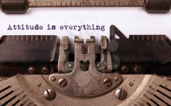 Vintage inscription made by old typewriter, attitude is everything