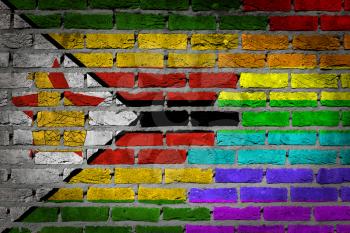 Dark brick wall texture - coutry flag and rainbow flag painted on wall - Zimbabwe