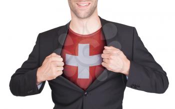 Businessman opening suit to reveal shirt with flag, Switzerland