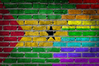 Dark brick wall texture - coutry flag and rainbow flag painted on wall - Sao Tome