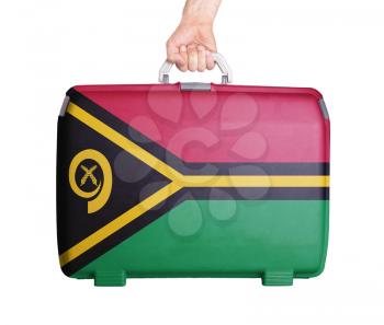 Used plastic suitcase with stains and scratches, printed with flag, Vanuatu