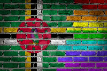Dark brick wall texture - coutry flag and rainbow flag painted on wall - Dominica