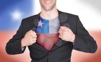 Businessman opening suit to reveal shirt with flag, Chile