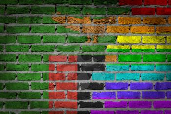 Dark brick wall texture - coutry flag and rainbow flag painted on wall - Zambia
