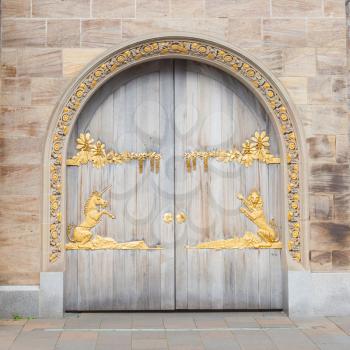 Door with gold plating, unicorn and lion