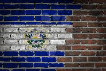 Very old dark red brick wall texture with flag - El Salvador
