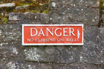 Red sign, danger, no climbing on walls