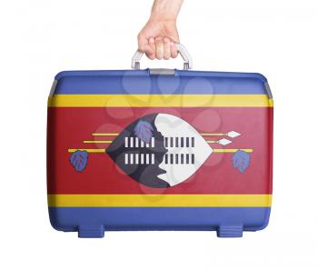 Used plastic suitcase with stains and scratches, printed with flag, Swaziland