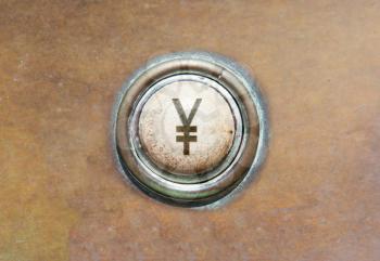 Grunge image of an old button - Yen