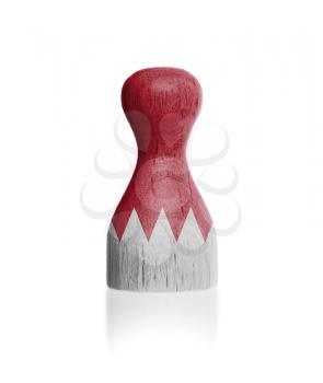 Wooden pawn with a painting of a flag, Bahrain