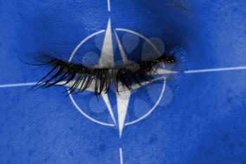 Women eye, close-up, concept of grief, NATO