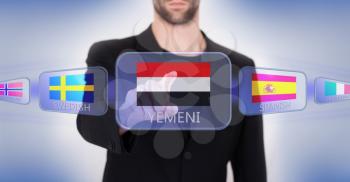 Hand pushing on a touch screen interface, choosing language or country, Yemen
