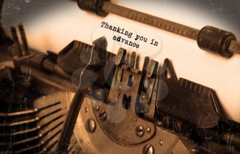 Close-up of an old typewriter with paper, selective focus, thanking you in advance