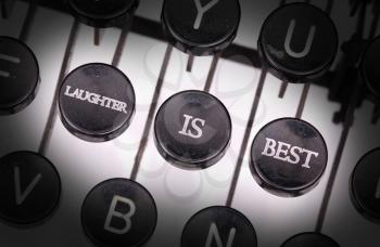 Typewriter with special buttons, laughter is best