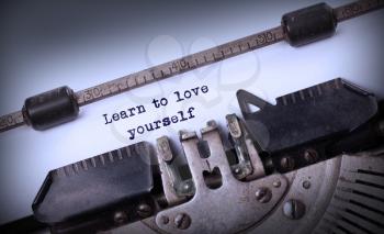 Vintage inscription made by old typewriter, Learn to love yourself