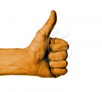 Closeup of male hand showing thumbs up sign against white background, orange skin