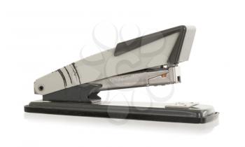 Close-up of an old rusty vintage stapler, isolated on white