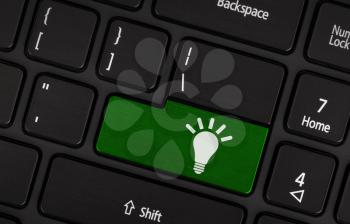 Laptop keyboard with light bulb symbol on it