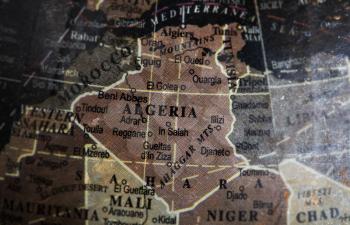 Algeria map on vintage crack paper background, selective focus