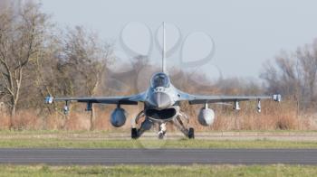 LEEUWARDEN, NETHERLANDS - APRIL 11, 2016: A dutch F-16 on the ground during the exercise Frisian Flag. The exercise is considered one of the most important NATO training events this year.