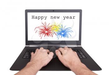 Man working on laptop, happy new year, isolated