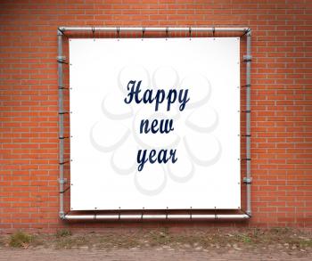 Large banner with inspirational quote on a brick wall - Happy new year