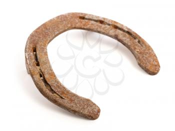 Old rusty horseshoe, isolated on a white background, selective focus