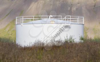 White gas storage tank in the west of Iceland