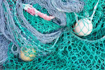 Abstract background with a pile of fishing nets ready to be cast overboard for a new days fishing