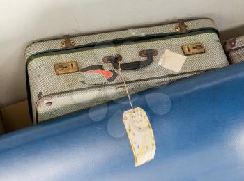 Old suitcase for cabin baggage - Selective focus - Inside an old airplane