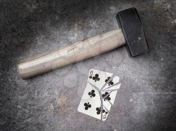Hammer with a broken card, vintage look, six of clubs
