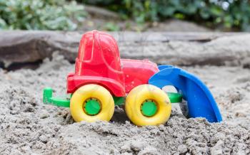 Children's machine in the sand, selective focus